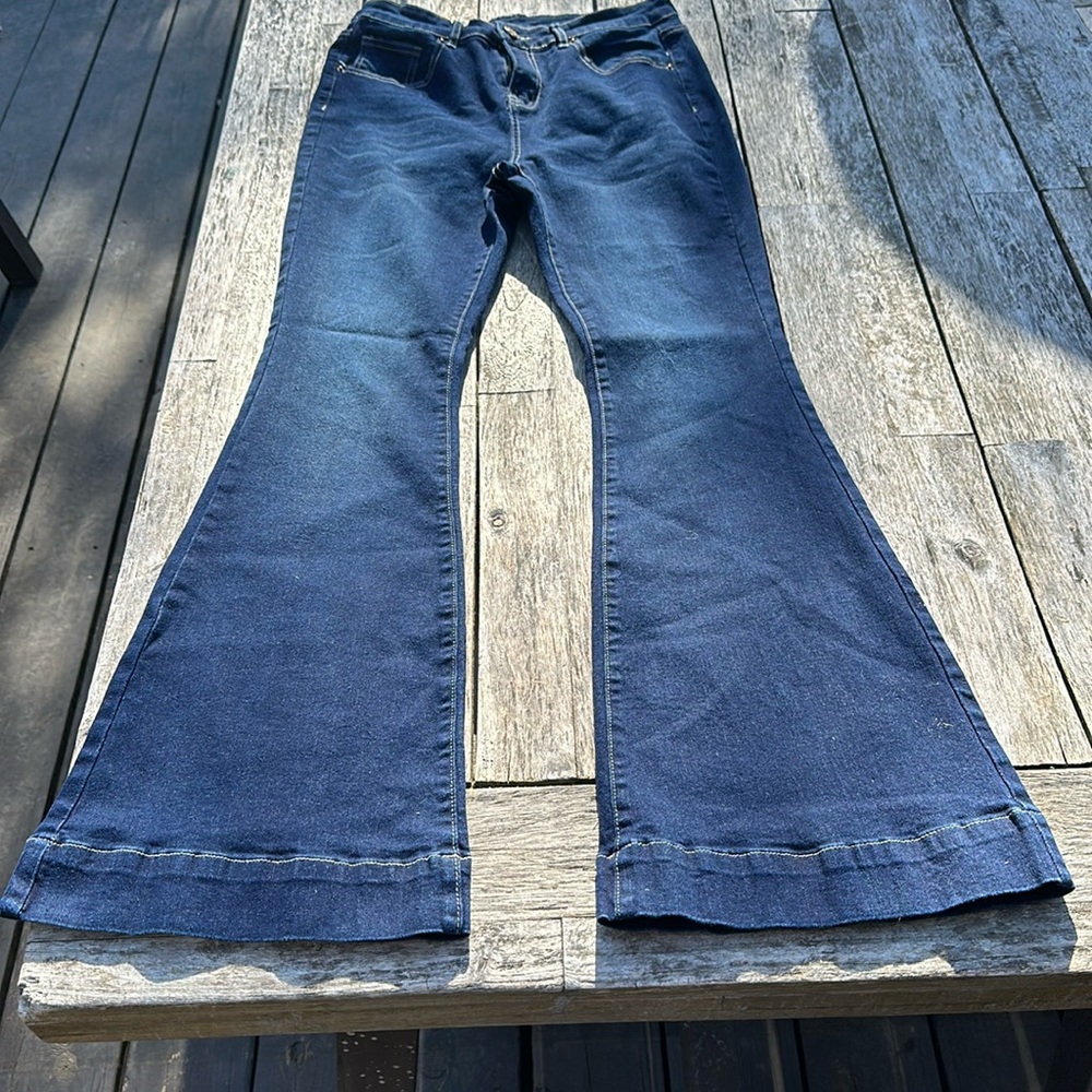 Fashion Brand distressed denim jeans with serious flare leg